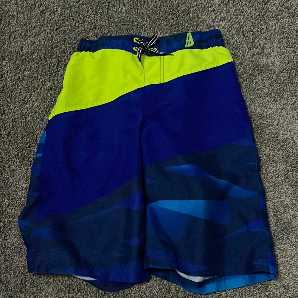 selling ZeroxPosur swim shorts. they are a size 10/12 in boys